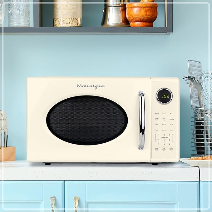 Nostalgia Retro 1000W Microwave Oven 1.1 Cu Ft Capacity ??Child Safety Lock, 8 Auto-Cook Settings ??Countertop Kitchen Appliance ??Ivory