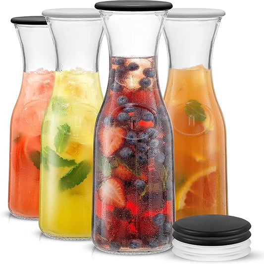 JoyJolt Glass Carafe with Lid, Set of 4 ??1 Liter Glass Pitcher for Mimosa Bar, Water, Iced Tea, Juice, Wine, Lemonade, Milk ??Dishwasher Safe Beverage Drink Dispensers for Brunch, Parties